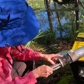 District staff assess the water quality monitoring station at Ichetucknee Springs.