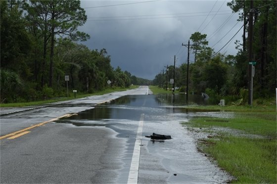 Paved road partly under water in Steinhatchee, Florida.