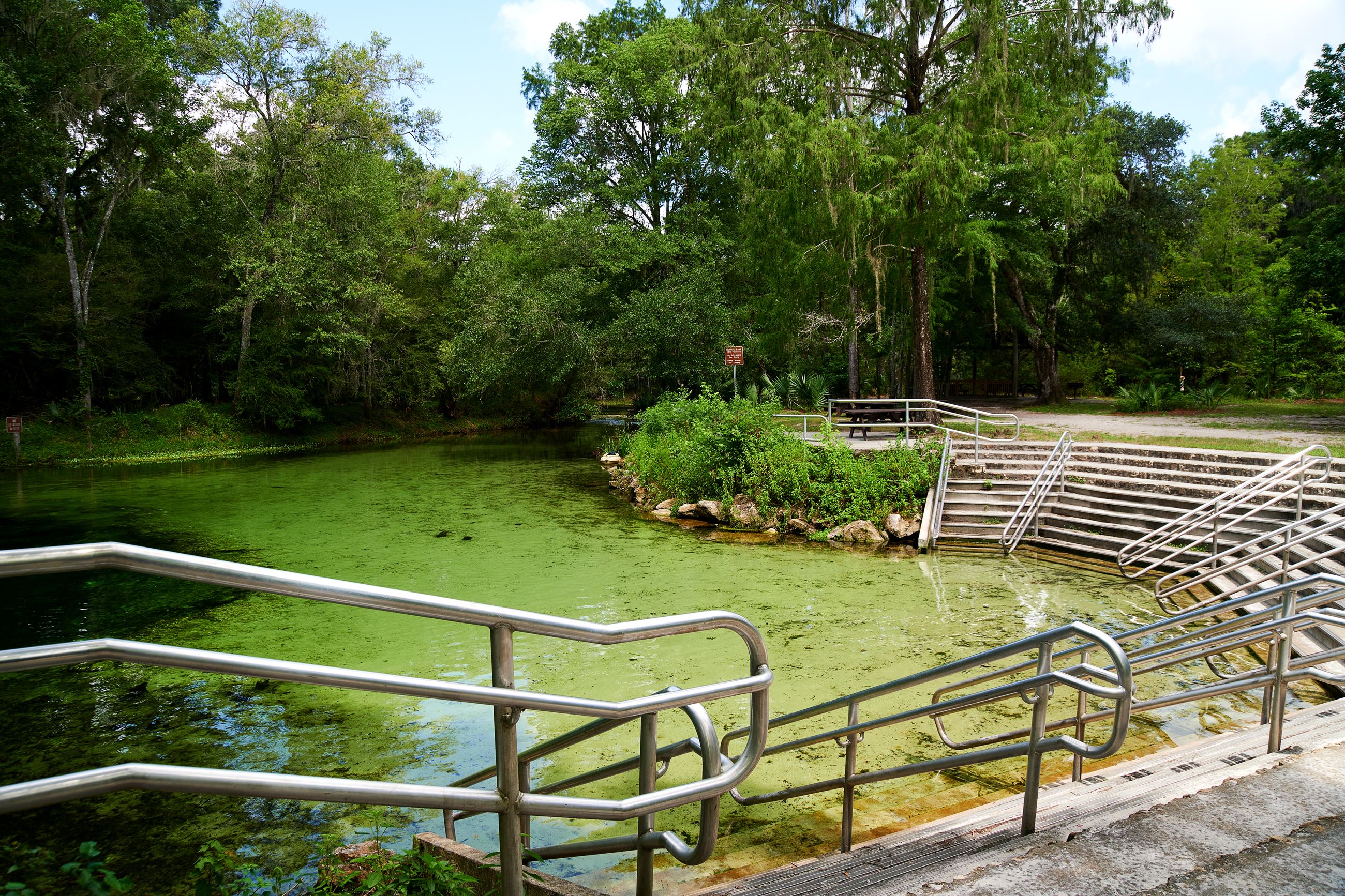 A spring with stairs at the entrance.